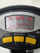 Metal detector control panel with display and buttons on a white background