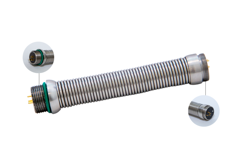 Forbest SK-C16 flexible stainless-steel spring cable connector for sewer and pipe inspection cameras, showing detailed close-up views of both male connector ends and gold-pin terminals.