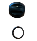 Black cylindrical object and ring on a clear plastic bag with a wooden surface background